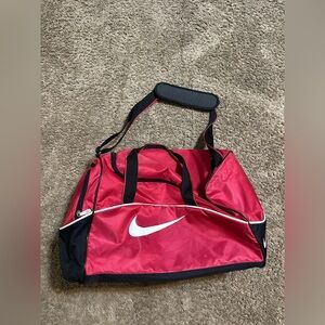 Vintage Nike sportswear “triple black & red” duffel bag 00s